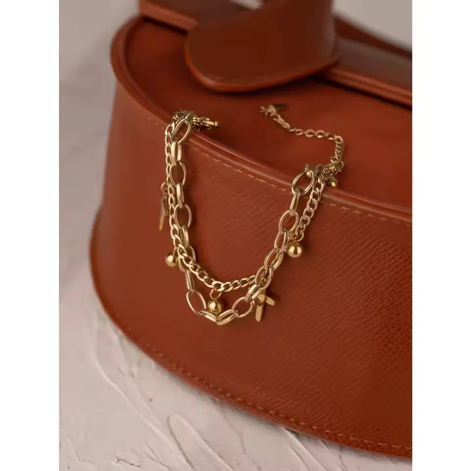 Pulseira Feminina com Cruz em Aço Inoxidável Banhada a Ouro 14K